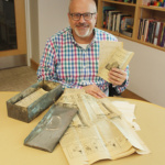 Photo of Rev. Greg Daly with the contents of the time capsule - taken by Alan Shackleton
