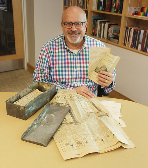 Photo of Rev. Greg Daly with the contents of the time capsule - taken by Alan Shackleton