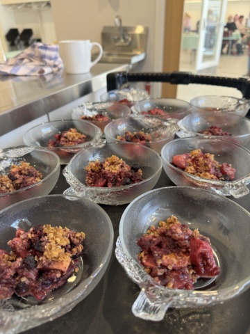 Warm fruit crumble being dished out for our lunch