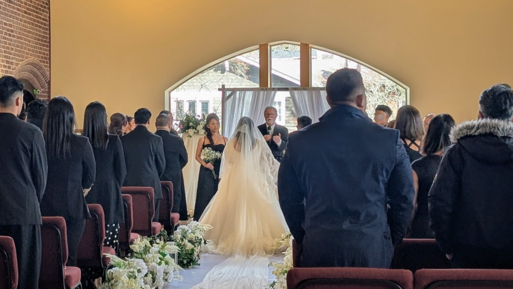 Wedding ceremony in the Main Hall at Beach United Church in Toronto’s Beaches neighbourhood.