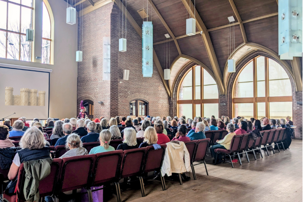 Full audience attending a lecture in the Main Hall at Beach United Church in Toronto